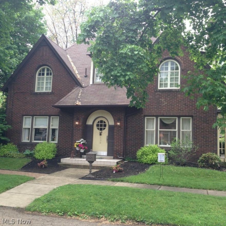 The owners have spent the last 7 years making this home like new! Outstanding English Tudor home with charm and character throughout. 4 bedrooms, 3 full and 2 half baths. New Cherry hardwood floors, 5" crown molding and 7" baseboards throughout. Beautiful gas log fireplace with travertine tile in the living room. Schrock kitchen and separate pantry. Built in Schrock bookcases in the Library. First floor addition includes a family room with vaulted ceilings and a wet bar, full tiled bath and separate laundry room. Finished basement includes the fourth bedroom, a game room and a full tiled bath. Wood floors in the attic with plenty of storage space. Updates also include roof, plumbing, electric, water heater and heat pump which includes zone controls for the first floor and the basement. Detached 2 car garage surrounded with built in storage cabinets connects to the outdoor kitchen with vaulted ceilings. Additional 4.5 car detached garage built in 2010 at the rear of the lot. Amazing par