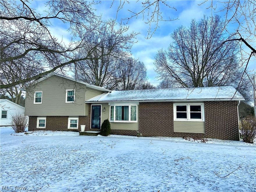 Welcome home to 2065 Diamond St. NE in Plain Twp.!  This 4 Bedroom 2 Full Bath  split level is situated on a corner lot with tons of updates and features!  Buyers will fall in love with the updated kitchen featuring granite countertops and custom soft close cabinets.  The kitchen is large and open with two pantries and accesses the living room with updated laminate flooring.  Just off the kitchen is the 3 season room with vaulted ceiling and access to private vinyl fenced backyard with patio and firepit.  The backyard offers a large shed with electricity perfect for storage or man cave!  The lower level offers a wood burning fireplace and wet bar with access to additional bedroom with full bath including tiled shower and walk-out access to backyard.  Just minutes from Washington Square and Oakwood area!  Call it home today!