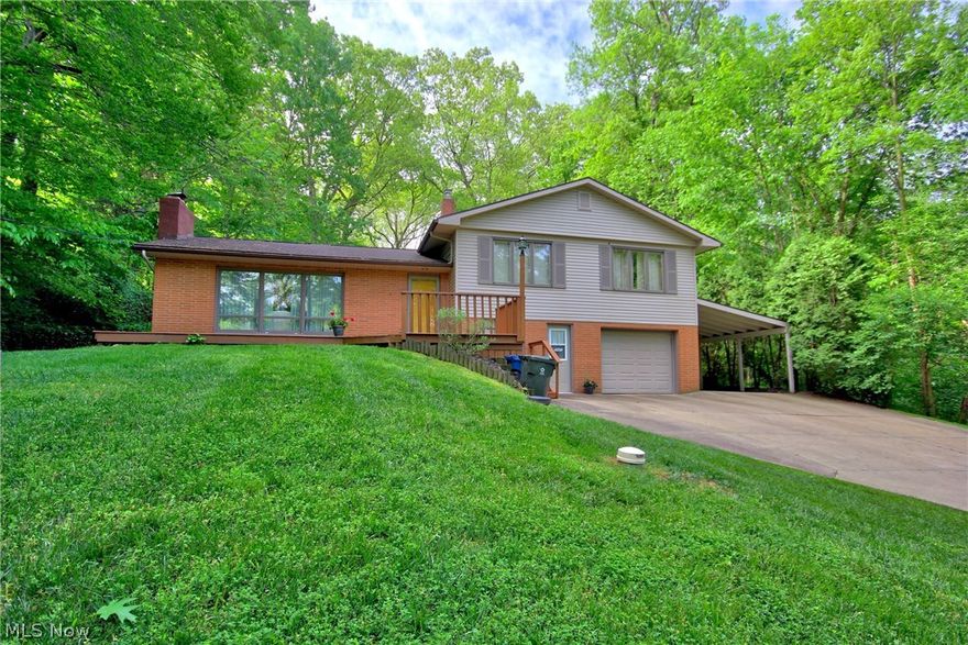 Welcome to this serene, picturesque home on almost an acre! Located on a quiet cul de sac and tucked away on a wooded lot, is this unique home that features a wooden, vaulted ceiling in the great room, first floor master with en suite, and 3 large bedrooms located on the second floor. Master bedroom, bath and great room all of heated floors.  Newer roof, large front porch, fireplace in the living room, large deck and concrete patio overlooking back yard, and so much more... This home is a must see!!!