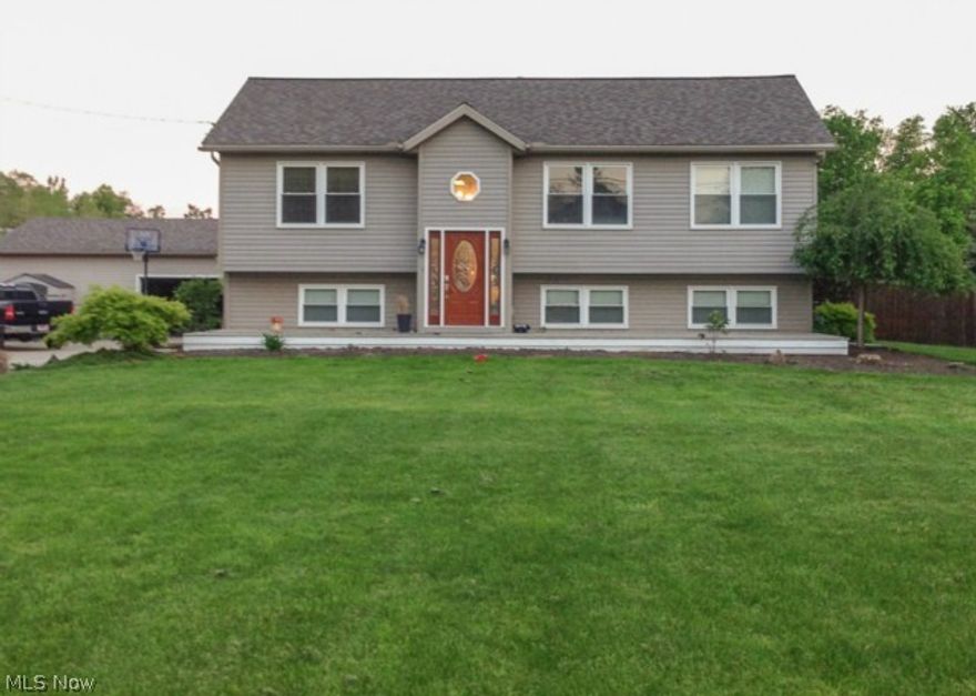 Updated! Kitchen has newer maple cabinets, hardwood flooring & open floor plan throughout. The living room and great room are located on the first floor. You will also find 4 bedrooms and 3 full baths. Master bedroom has full bath and walk-in closet. The lower level has family room and laundry room. Outside you w ill find a picturesque backyard with garage/pole building, 36 x 24. 2 tier deck, above ground pool and a basketball court 32 x 24. Look forward to your visit.