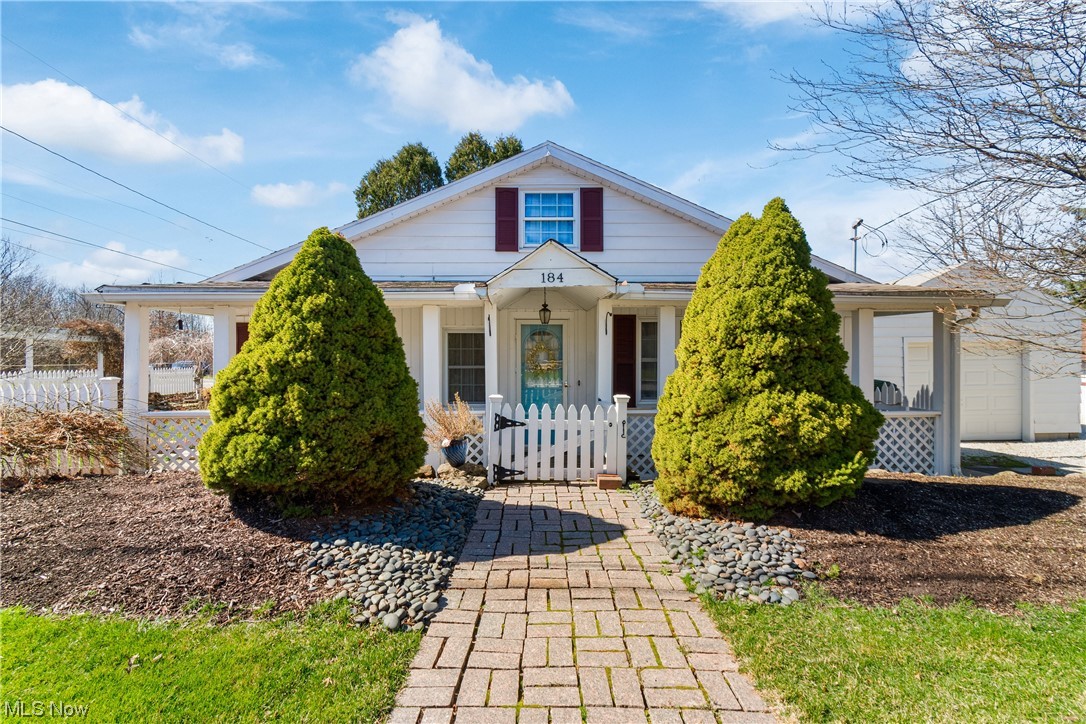 Welcome to the most charming cottage in Wadsworth! Nestled near the park, this cozy bungalow is loaded with charm. From the white picket fence, to the wide front porch and lush side yard full of perennials- you will be sold at first look. Walk into the spacious foyer that opens into the family room. The flooring and paint are all in neutral colors so all you have to do is move in. The bright kitchen boasts granite counters and stainless steel appliances. The first floor also has 2 bedrooms and a full bathroom. Upstairs is large and open and could be a master bedroom or divided up into an office area. Possibilities for days! This property also has a one car detached garage.