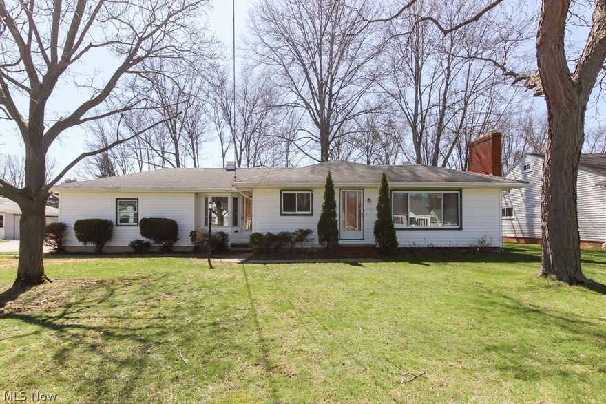 Welcome home to this meticulously maintained ranch. Nestled in a park like setting, this home is priced to sell and has much to offer. Upon entry you are greeted with an open, spacious living area with a neutral palette, featuring a gas fireplace and huge picture window. To the left is the well appointed kitchen with eat in nook, all appliances stay. Natural light and original hardwood floors abound throughout the home. Flex space is offered with the breezeway, & would make for a fantastic mud room. Three bedrooms are down the hall including the ample master bedroom. The basement promises extra square footage, is the footprint of the home, provides a built in bar, work shop, laundry area, and half bath.Enjoy yourself in the impressive yard that is over half an acre and provides a covered concrete patio Beautiful, serene, endless opportunities. Fantastic value, schedule your showing today.