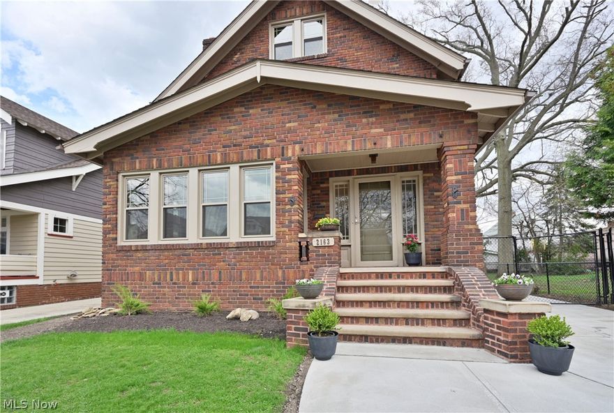 Welcome Home! Beautifully updated and filled with timeless charm, this 4-bedroom all-brick Colonial showcases exceptional craftsmanship, character, and thoughtful improvements throughout. From the moment you step inside, you'll appreciate the rich natural woodwork, custom built-ins, and warm, inviting spaces that make this home truly special. The spacious main level features a large living room with a fireplace and built-in bookcases, creating the perfect setting for everyday living or entertaining. Just off the living room is a bright and versatile sunroom, ideal for a home office, playroom, reading nook, or additional sitting area. The formal dining room is full of charm with beautiful built-ins, while French doors lead to the patio and backyard, offering a seamless indoor-outdoor flow for relaxing or entertaining. At the heart of the home is a sun-filled, beautifully renovated new kitchen featuring new cabinetry, Quartz countertops, and all-new stainless steel appliances. A newly added first-floor half bath provides added convenience and functionality. Upstairs, you'll find four bedrooms and a beautifully updated new full bathroom. The finished third floor/attic has been transformed into a huge private retreat complete with new baseboard heating, perfect as an additional living space, guest suite, home office, or future luxurious primary suite. This home has been extensively updated for both beauty and peace of mind, including all new windows, new gutters, new first-floor flooring, professionally refinished hardwood floors upstairs, new lighting throughout, three updated bathrooms, basement waterproofing, new A/C, new hot water tank, updated plumbing, updated electrical, a new driveway, new garage concrete flooring, and a new garage door opener. Blending timeless craftsmanship with today's modern updates, this home offers the best of both worlds. Ideally located in one of Northeast Ohio's most desirable and vibrant communities, and just minutes from downtown