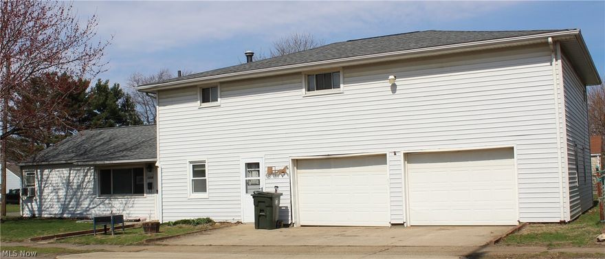 There is something for everyone in this unique home, featuring 5 bedrooms & 1.5 baths has so many features.  The main floor has 2 ample bedrooms with large closets, along with the entryway from garage with lots of storage and the first floor laundry (washer/dryer stays), a brand new eat-in kitchen, half bath and very large living room!  Upstairs includes 3 well-sized bedrooms and full bath.  Updates include NEW ROOF in 2025 and new kitchen with all new cabinetry, granite counters, new floor and stainless steel appliances.  Also a new gas boiler system was installed with zoned heat in 2024.  The huge 2+ bay garage has a grease pit in 1 bay with steps leading down to make working on the engine much more convenient!  The garage is oversized with lots of space and storage for workbenches, etc., along with hot/cold water, 2 drains and heating available.  Garage also has an upper room for a "man cave" or party room and an extra loft for storage!