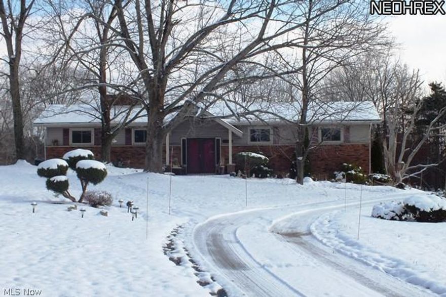 Spacious home in Novelty, set on almost 2 acres of lawns and wooded areas this home offers West Geauga schools a National Blue Ribbon School system. Open & inviting layout, great for entertaining.Low maintenance vinyl siding & brick, wide brick walkways, front patio with brick planter boxes and large newer windows. Updated kitchen includes all appliances with great storage & counter space. 2 wood burning fireplaces - one upstairs and the second in the walk-out basement. Huge deck off living room overlooks huge wooded yard. 2 shaded patios at rear.2-car attached garage plus lots of parking areas outdoors. Conveniently located with a country feel but close to everything: 30 minute drive downtown, 15 minutes to Beachwood Mall & I-271 & 10 minutes to Mayfield Heights. Great value, home is sold AS IS.