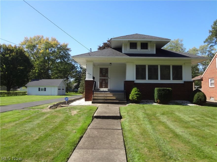 Spacious ranch on scenic lot! Well maintained two bedroom home featuring beautiful natural woodwork and enclosed front and rear porches for indoor-outdoor living. Generous entry foyer with guest closet and beautiful oak hardwood under carpet. The living room features a gas fireplace. Large eat in kitchen with all the appliances to remain. Large formal dining room with beautiful window seat. Walk up attic for extra storage. Immaculate semi-finished basement with vinyl tile floor, full bath, and partitioned rooms for all of your hobbyist needs. Two car detached garage and a shed for outdoor equipment. Newer roof, high-end windows, water heater and exterior painting. Tulips planted in raised bed for Spring. Come make this house your Home!