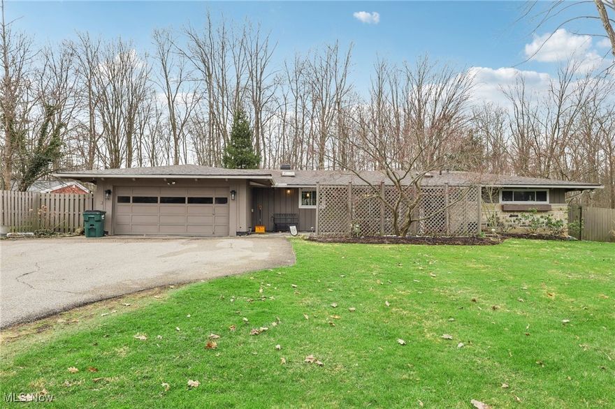 Charming Ranch in Chagrin Falls – Modern Living with a Prime Location! Welcome to this light, bright, and beautifully updated 3-bedroom, 2-bathroom ranch-style home, perfectly situated near the heart of Chagrin Falls Village. Step inside to discover a modern, airy interior featuring an open and easy-flow floor plan, completely remodeled from top to bottom. Updates include new floors, trim, doors, and vaulted ceilings. The spacious family room features vaulted ceilings, a skylight that fills the space with natural light, and sliding doors leading to a back deck – perfect for relaxing or entertaining. A gas fireplace adds warmth to the living room. The large, fenced yard beyond the deck offers privacy and ample space for outdoor activities. A newly added portico on the patio enhances outdoor enjoyment. The well-designed kitchen seamlessly connects to the dining area, featuring marble countertops that add a touch of elegance. Heated floors throughout much of the main living space ensure comfort. The first-floor laundry room is equipped with a new washer and dryer (2024), and an attached 2-car garage adds convenience. Additional updates include a furnace and A/C from 2016 and a brand-new stove from 2024. Located just minutes from Chagrin Falls Village, schools, and local amenities, this home offers a perfect blend of style, comfort, and convenience. It’s part of the sought-after Chagrin Falls School District and benefits from lower Geauga County taxes – truly the best of both worlds! Don’t miss your chance to enjoy the vibrant Chagrin Falls lifestyle!