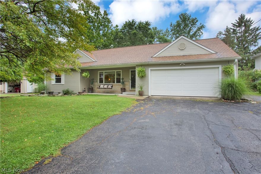 Welcome home to peace and tranquility.  This 3 Bedroom 1 Bathroom ranch is situated on a beautifully landscaped acre lot....Endless opportunities to entertain with a large patio, above ground pool and tons of yard space.  A bonus 24x24 garage and workshop with electric is in the backyard along with a separate shed for more storage space.  Inside you'll find an inviting living room with new carpet and gorgeous wainscoting to give it a custom touch.  The kitchen boasts plenty of cabinets with a large eat-in dining area.  All the updated stainless steel appliances in the kitchen are included.  Two of the bedrooms are carpeted, but all three bedrooms have original hardwood flooring.  The house is filled with natural sunlight from the newer vinyl windows.  Pride of ownership shines through this well maintained home.  A one year home warranty is being offered to provide peace of mind.  Come take a look before it is too late!