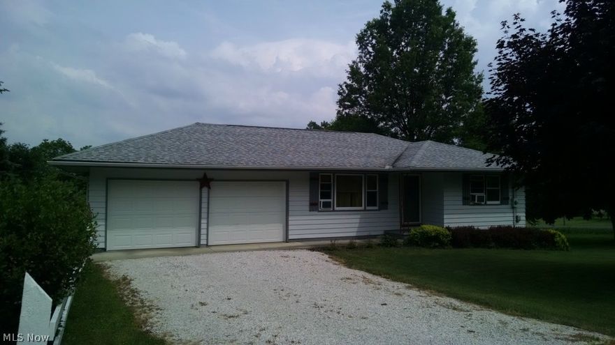 This is the One!! Very well maintained 2 bedroom, 1 bath Ranch home with full basement, 2 car attached garage on over an Acre!! Possible 3rd bedroom in basement. Enjoy an Elevated Country view on the back deck. New 40 year 3-D shingles roof, New windows and exterior paint. All appliances stay. Southeast schools. Close to  3 lakes, Lake Milton, Berlin, and West Branch. Call today for a showing!