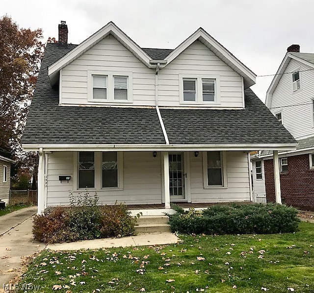 Welcome Home to your 3 stories, completely updated home. You will enjoy an open floor plan with an updated kitchen with separate dining room. Updates in kitchen include flooring, countertops, and newer stainless steel appliances and gas cooktop range. The hardwood floors have been refinished throughout the home. Large windows let in tons of light. Large, updated bathroom has 2 sinks, newer tub surround and lots of room. 3 good size bedrooms ont he second floor and the 3rd floor has a bedroom as well. Half bath is enclosed in the basement and basement is partially finished. Newer roof, front porch, water heater, and Anderson Silverline windows all in 2013. Mud room added and front lawn property graded in 2013. All appliances including washer and dryer stay. New garage door in 2015.