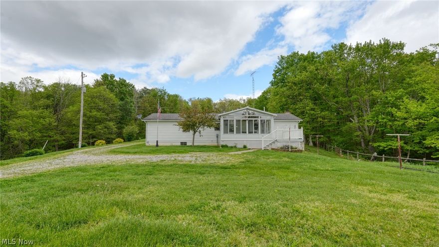Set on approximately 6 private, secluded acres (survey to be completed) with fruit trees and berries, this charming 3-bedroom, 1-bath home offers the perfect blend of comfort and country living. Inside, you’ll find new carpet, a spacious sunroom that provides an abundance of natural light and a relaxing space to enjoy the surrounding views, and a kitchen fully equipped with a refrigerator, range, and dishwasher. A walk-out basement adds versatility for storage, hobbies, or additional living space. Outside, the property features two barns, including a heated workshop with concrete floor—ideal for projects, equipment, or business use. A rare opportunity for privacy, functionality, and room to roam.