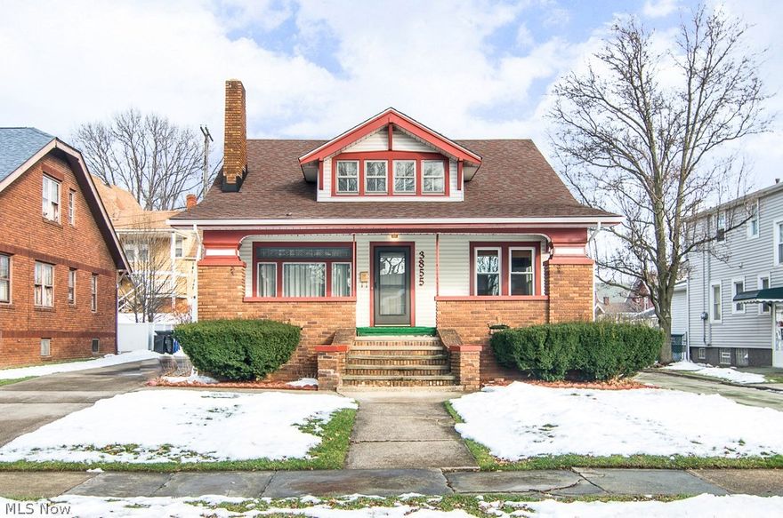 Expanded master bungalow ready to move in! Featuring a dramatic living room w/ fireplace and full light-brick wall w/ wood mantle, gleaming narrow hardwood floors and elevated study or music area with built in natural wood bookcase and new plush carpeting. The dining room is a real treat too w/large window seat w/ natural wood drawers and trim and leaded glass cabs. Now the kitchen, which boasts beautiful oak cabinets, beveled Formica counter tops and newer vinyl floor! All bedrooms are nicely proportioned & graced w/ new carpeting and 1 bedroom up has cherry stained narrow hardwood! Full clean basement w/ plenty of space to finish into whatever you want! Newer garage door and opener, private rear yard and patio!