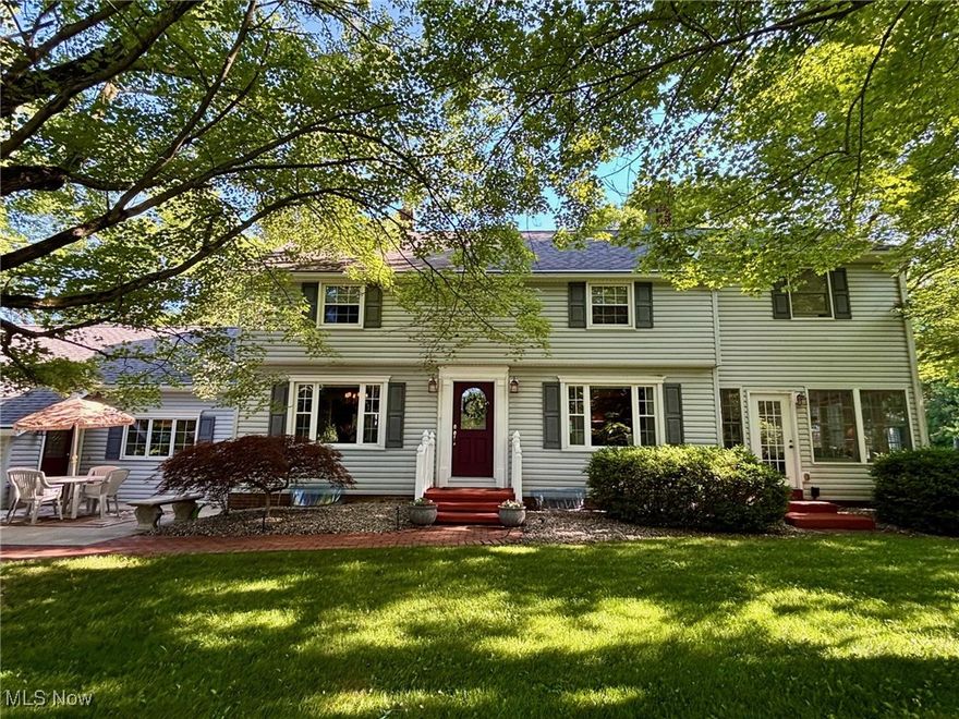 Welcome to this private 17.9-acre estate in Charlestown Township! With over 4,000 sq ft of finished living space, this home offers 4 bedrooms, 3.5 baths, with two spacious primary suites—perfect for multi-generational living.
The main-level suite features cathedral ceilings, an electric fireplace, walk-in closet, French doors leading to a patio with hot tub, plus a spa-like bath with soaking tub, separate shower, and in-suite laundry. The second-floor suite includes double closets, original oak hardwood flooring, and a large bathroom with cathedral ceiling, skylights, soaking tub, shower, linen closet, and access to a private deck—ideal for relaxing in the sun.  Two additional spacious bedrooms are located on the second floor and also feature the original oak hardwood.
The heart of the home is the kitchen, complete with stainless steel appliances, Corian countertops, island, pantry, and stunning views of the scenic property. Multiple living areas include a dining room with tray ceiling, a living room with wood burning fireplace, a family room with gas fireplace, a four-seasons room surrounded by natural light, and a finished basement with gas fireplace. The office, with separate entrance, could also serve as a fifth bedroom suite or bonus room. A heated attached 2-car garage with built-in cabinetry adds convenience.
Enjoy outdoor living with 3 patios, 2 decks, gazebo, hot tub, gas fire pit, gas grill hookup, and a playhouse. The 3-stall barn with water, electric, hay loft, and extra storage is ideal for animal lovers. Mineral rights convey with the property—no gas bill and receive gas well royalties. This home has been well-maintained and regularly serviced.  Too many updates to list but include: Main furnace (2024), Both A/C (2024), Roof (2017), and Hot Water Tank (2017). One-year home warranty included for peace of mind!