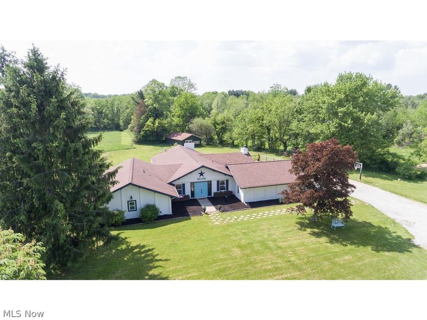 Welcome to this special property in the sought-after Hinckley community that gives you country living in a beautifully updated home. This nature lover's retreat offers over 5 acres backing up to the East Bank Rocky River, stocked pond for fishing, wooded and grassland areas and a 30x20 barn. Home features an open floor plan, custom designed kitchen with granite countertops and stainless steel appliances, unique stacked stone wall in dining area, and an expansive family room with vaulted ceilings, rustic wood beams and built in shelving and cabinets. Master includes updated en-suite with rain shower and deep soaking tub. Offering you the best of one-level living, this charming Ranch has 4 bedrooms, a bonus room (currently being used as a guest room), office/craft room, and an extra large mud room/laundry room right off the garage. Your guests will love your amazing covered stamped concrete patio with vaulted ceiling, fan, stone fireplace and wired for your big screen TV! Less than 3 mil