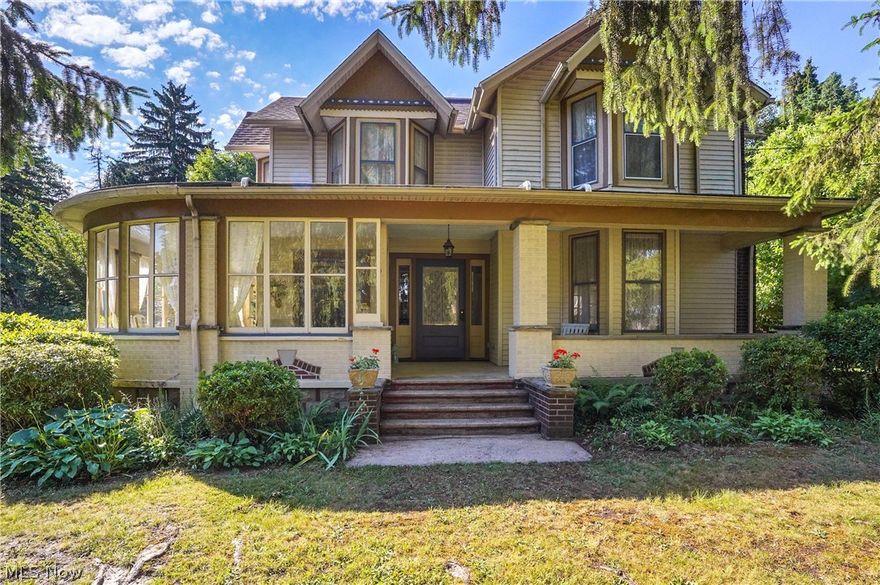 Extraordinary century home on an incredible piece of property in the heart of Ravenna Twp. This 4-acre double lot is spectacular. A dream for gardening and hobbyist. Updated throughout, including the kitchen, both bathrooms and expanded mudroom, this home still maintains its original charm and traditional appeal. Upon entry you will immediately notice the rich original hardwood flooring throughout. Bayed windows grace the architecture and provide an abundance of natural lighting. Flanking the entry a formal living room and family room with custom wood working and a wood burning fireplace appeal to a large family's needs. A private office allows you to work or have classes uninterrupted. A formal dining room gracefully opens onto the enclosed wrap around porch. The kitchen was updated with new countertop, appliances, white cabinets with new hardware and tiled backsplash while keeping the charm of the country kitchen. Built in cabinetry in the breakfast nook helps provide ample storage while plantation shutters add style. The mudroom has built in storage and bench, but it is also large enough for home gym equipment and provides access to patio, gazebo and exterior of home. The bonus room above is perfect as a craft or playroom. The main level is completed with a tiled bathroom remodeled in the tradition of a century home. Ascending to the second level, the rich hardwood flooring and custom woodwork are present in all four generous sized bedrooms. Bayed windows, cedar closets and natural lighting are ever present. The main renovated bathroom has heated tiled flooring, claw foot tub, tiled shower and age representative hardware. Thoughtfully relocated to this level the laundry has Samsung washer and dryer and built in cabinetry and countertop. The owners have loving cared for and completed these upgrades, H2O heater-2018 Two furnaces- 2018 A/C-2018 Electrical panel-2020 Attic insulation-2015 Radon mitigation system-2014 Roof 2020. Call to see this beautiful home today!