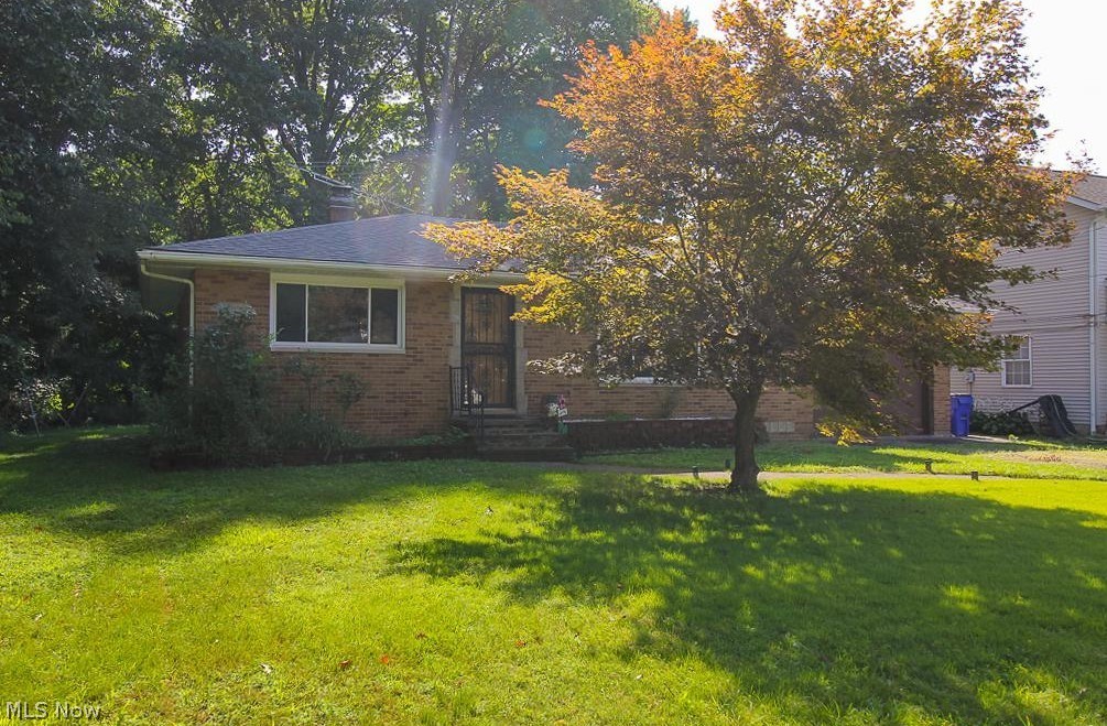 Welcome home to this charming brick ranch in Old Brooklyn. Walk in the front door to a spacious family room for entertainment. Enjoy the winter months with a cozy wood burning fireplace. A kitchen to enjoy meals with the family and double doors leading to the patio and huge backyard. 2 bed 1 bath home. Beautiful spacious front and backyard with many cookouts/entertainment to enjoy the company of family and friends for many years. Extra living space in the basement with bar, wood burning fireplace and laundry hookups. Plenty of storage throughout. 2 car attached garage. A block away from Cleveland Metropark Zoo and Steelyard commons. Newer roof, hot water tank, furnace, a/c. vinyl flooring and fresh paint throughout. House sits on a dead end street. Don't miss out...this beauty will not last long.