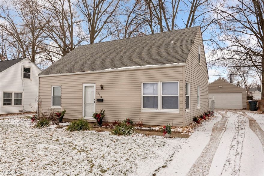 Welcome home to this charming Cape Cod in Cuyahoga Falls! Entering through the front door you are greeted by plenty of natural light as you come into the main living space with laminate wood floors, built in shelving and pass through to the kitchen creating a more open feel in the home! Large eat in kitchen with tile floors, appliances that stay and connected laundry. Featuring 4 bedrooms with two of the bedrooms and the updated bathroom on the first floor you have the ability for one floor living if needed! Exterior features a detached 2 car garage, back patio and fully fenced yard!