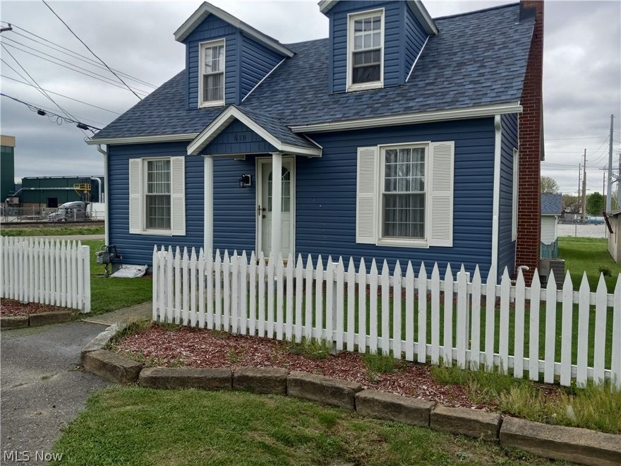 Great curb appeal for this 1 1/2 story home with 2 car detached garage, fenced in yard and back deck. Updates include: 30 year roof put on about 5 years ago, garage roof new in 2024, siding in 2024 by Greg Moore, basement wall reinforced with beams and sump pump installed within last 6 years, gas furnace and gas water heater, all flooring installed within the last 5 years. Home has walk out basement. Upstairs bedrooms do not have closets. Homeowners Insurance is through Peoples Bank. Vacant lot along Central Ave is not included. Driveway to garage is an open alley per auditor's office.  Garage is 24X30 built in 1991.