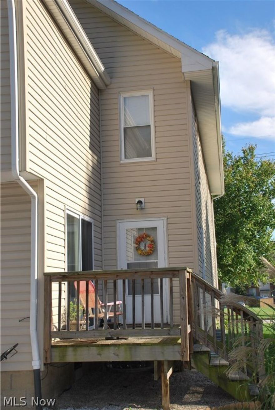 This is your opportunity to occupy a gorgeous two story unit built about 6 years ago as a 3rd unit to a duplex apartment with bamboo laminate floors, hardwood in the living room, beautiful kitchen and bathroom with tile and slate, awesome sliding glass doors to small personal deck for your relaxation! There is even laundry as a stacked system in the unit! This multi unit building has been completely remodeled in the past few years as well. The water heater was replaced in 2014, also has had insulation blown in and vinyl siding installed, new roof was installed 2014 and new windows installed 2014, and the bathroom was built 2014! The Living Room is the only original part of the unit with hardwood floors! Kitchen appliances also provided. Outdoor back area with swing and grilling area with privacy fence. PLEASE NOTE THAT THIS UNIT IS A 2-STORY with the Living Room, Dining Area, Kitchen and Laundry on the 1st floor level and the Bathroom and Bedroom are on the second floor! The bathroom h