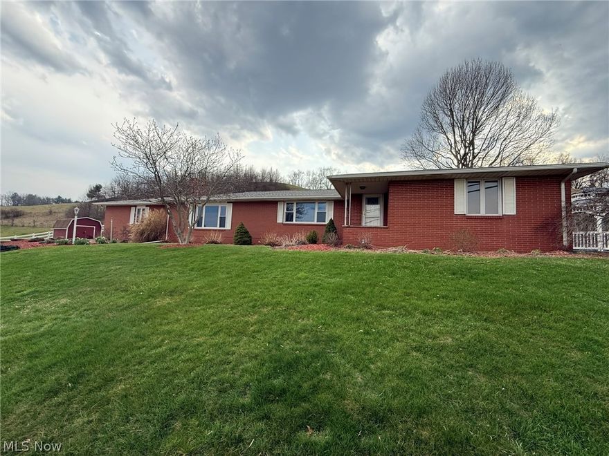 Country living...minutes from town.  Well maintained all brick ranch on 1.2+/- acres.  Quality, Hostetler built home featuring 3 bedrooms, 1.5 baths.  Fresh paint and new carpet throughout.  Corian counters in the kitchen featuring tile backsplash.  Sliding glass doors from the dining room to the covered 22 X 9 rear.  Sunken family room boasting Schrock built in cabinets and stone gas fireplace.  Potential main floor laundry.  Vinyl thermo replacement windows.  Water softener new in 2025+/-.  New asphalt roof in 2024+/-.  26 X 22 (2 car) attached garage includes pull down stairs to the attic.  Large stone patio with built in firepit and screen enclosed gazebo.  Beautiful country setting providing scenic valley views includes storage shed.  Taxes reflect the seller receiving a homestead credit of $371.46 annually.  Seller to retain mineral rights.  Current owner's utilities average $155 for propane and $250 for electric monthly.  115 gallon rented hot water heater with $22.50 monthly fee.