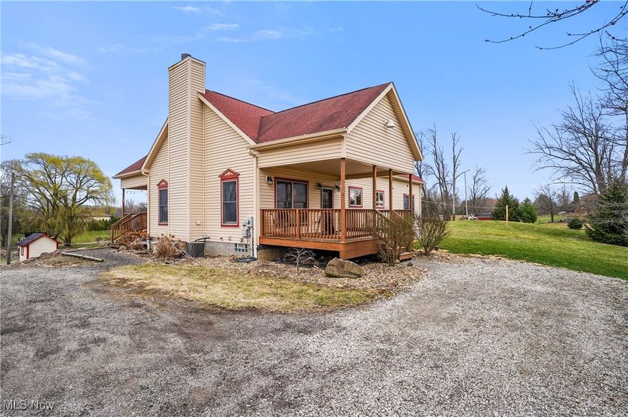 Welcome to 2040 Swartz Rd. Featuring 3 bedrooms and 2 full and 2 half bathrooms. Built in 2011 this great home is on 4.8 acres in Suffield Township. Two covered decks are great for gathering friends and BBQ's. Step inside and feel the grandeur of tall, vaulted ceilings, stone faced wood burning fireplace and an abundance of natural lighting. The open concept kitchen boasts wood cabinetry. wood flooring and includes all stainless appliances. First floor living is offered featuring the laundry room, secondary bedroom, and owner's suite. The large spacious bedroom has a walk-in closet and ensuite bathroom. Vanity, walk in shower, soaking tub and private toilet complete this area. The second level consists of a private area with the third bedroom, a loft and full bathroom. Outside you will find any hobbyist or mechanic's dream. The 40 x 60 pole barn has 3 large bays, car lift, air compressor, radiant heat floors, half bathroom & more. This unique home and property will not be available long. Call to schedule your private showing today!