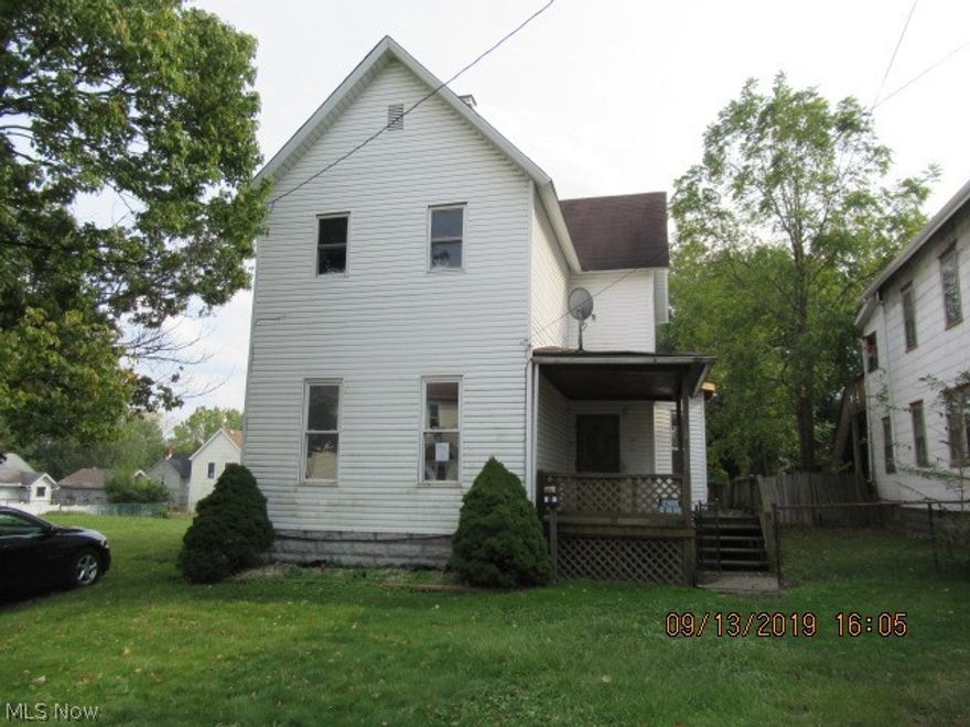 Large Size Colonial Home with Wrap Around Deck, Large fenced Back Yard, and Full Walk Out Basement. This Century Home has a Huge Kitchen, appears to have been updated at one point, tons of Oak Cabinets, First Floor Full Bath and Bedroom being used as a Laundry Room. Spacious Master Bedroom with double closets and Second Full Bath found in the Upper level. This Century Home is in need of updating and cosmetics, this is the perfect opportunity with some Sweat Equity and Elbow Grease this one would make a great home for a Large Family! Why pay Rent when you can own your own home! Location near Bus Lines, Freeways, City Hospital, Downtown and University Great for Investors, this one will make a nice addition to your portfolio, large size with increased Rental Income potential! Buyer is responsible for researching all information, taxes, assessments, and any intended end use with proper authority. Seller has no disclosures or reports. Property to be Sold AS-IS.
