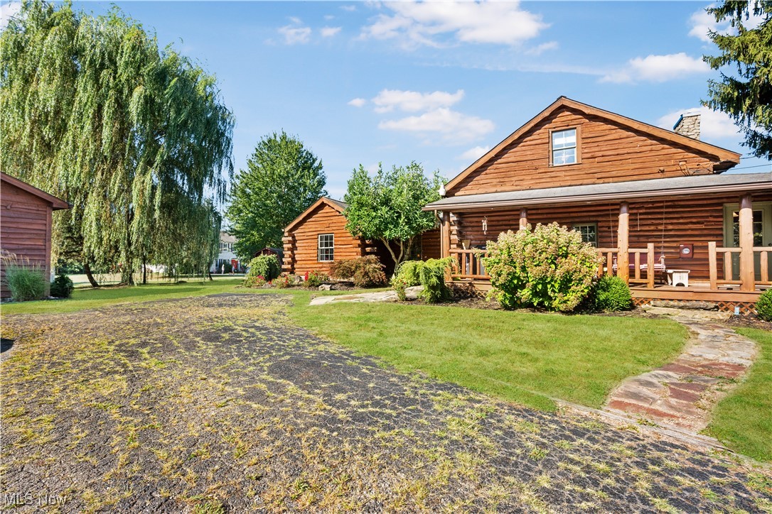 Charming two bedroom, two full bathroom log home, originally built in 1845. This home has been updated and modernized while keeping much of the original character. Starting at the full side porch, enter into either the den or the foyer. The den offers wonderful views of Moore's Tree Farm across the street. A generous foyer with a ceramic tile floor, is light and bright. A fireplace with a wood stove, wood floors, bead board walls, and original wood beams on the ceiling make the living very comfortable and cozy. Fully applianced updated kitchen with original wood beams on the ceiling, white cabinets, marble subway tile backsplash, and butcher block counters. A first floor master suite features a full updated en-suite bathroom with walk-in closet, and a spa-like walk-in shower. A second updated full bathroom, and a first floor laundry complete the first floor living space. The entire second floor is the spacious second bedroom offering wood floors, a large closet, and cubby hole storage area. The basement has original log beams, and stone foundation. A detached garage is heated with a wood stove has a door opener, attic access, lots of electrical outlets, and could accommodate 4 cars if park in tandem. Newer sump pump 2 years old, well pressure tank 4 months old, hot water tank 3 years old, oil tank 3 years old, furnace less than 1 year old. This home is a gem, don't wait to see it!