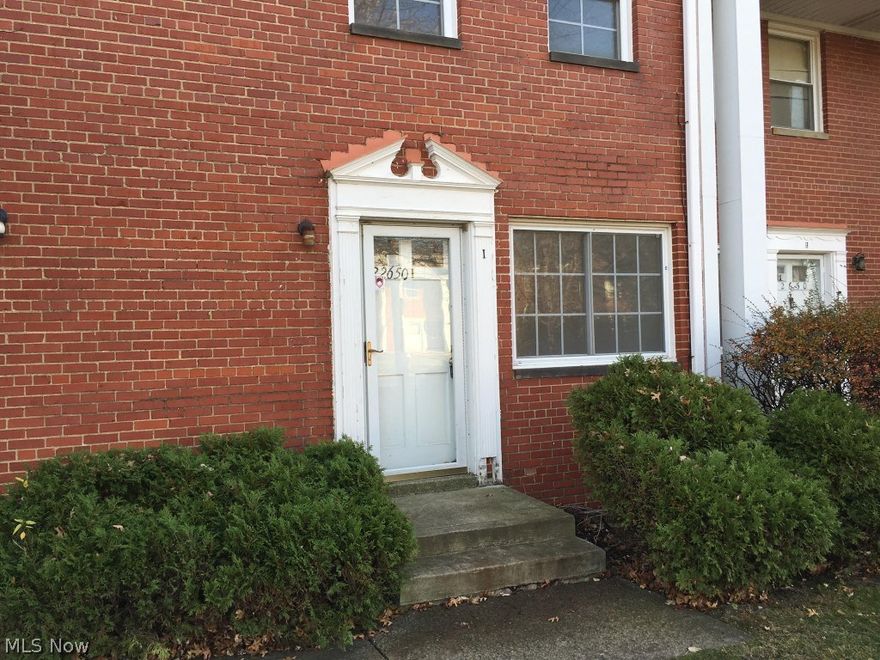 Great opportunity! Could be a starter home or investment property.  Brick townhouse/condo with 2 bedrooms and one bath on second floor.  Living room and dining room combination, finished rec room in basement with glass block windows and an assigned parking space.   Easy living lifestyle and close to everything!   Great price!