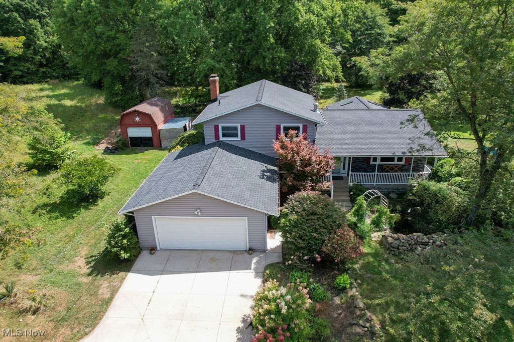 Welcome to your own slice of Hudson! This 3-bedroom, 2-bath split level home sits on 2 private acres, offering the perfect balance of space, comfort, and convenience. Inside, you’ll find a bright, functional layout with electric heat and central A/C for year-round comfort. The upstairs will be painted with fresh neutral colors in the upstairs bedrooms. Enjoy peace of mind with the roof and skylights replaced in late 2023 and motivated sellers covering the cost of a home warranty for a year which includes septic coverage! A two-car garage and outdoor shed provide plenty of storage, while the expansive, private backyard is ideal for entertaining, gardening, or simply relaxing in peace. All this just minutes from Hudson’s vibrant shops, dining, and top-rated schools -- making it a smart choice for both lifestyle and location.