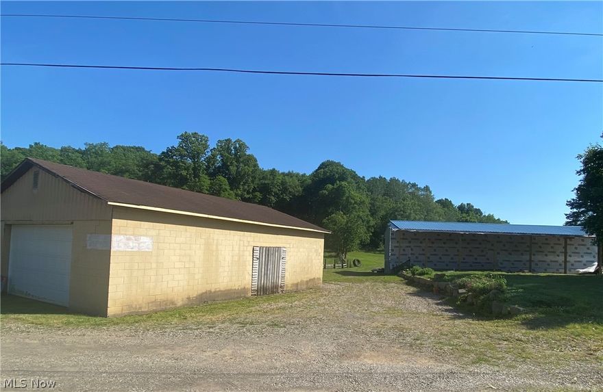 Beautiful stocked pond on 2+  acres with new home started and all utilities in place.  Finish how you want it while storing all your toys in the 30x40 block garage.  Property is already adorned with mature fruit trees and raised garden beds.