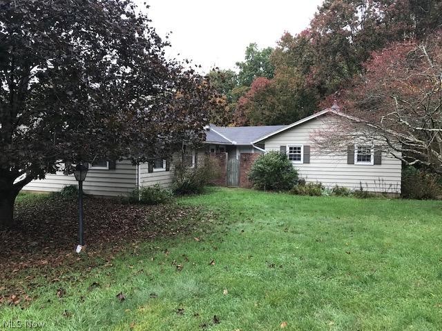 Wonderful ranch home tucked away in Henderson Height; barely outside the city limits. Close to hospital, doctors, schools & city park. Deck overlooks wooded backyard which borders small creek & makes it feel like country living. Spacious living room, dining room, cozy family room w/ brick fireplace off kitchen w/ dining area, lots of storage & 1st floor laundry. Replacement vinyl windows, redwood siding & basement has outside entrance. Homeowner is original owner. Dining Room light does not stay- will be replaced. MWCD is $6.00/year. Please follow Covid-19 Guidelines.