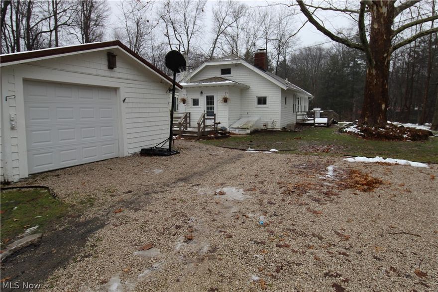 RIVER FRONT RIVER FRONT RIVER FRONT!!!!! Make this cozy ranch your home, getaway, or maybe you've always wanted a vacation rental in the popular Grand River Valley! This home is privately situated back off the road with 100ft of water frontage. Steps provide access to the river with your own landing for fishing and relaxing. Much attention to detail and upgrades! Spacious eat in kitchen boasts quartz countertops, new cabinetry with soft close doors and drawers and farmhouse sink! New carpet in all 3 perfectly sized bedrooms. Large living room with laminate flooring ,fireplace with wood burning insert and plenty of natural light from the new windows! Bonus room with access to the freshly refinished wrap around porch. New light fixtures inside and out 2020. Detached garage roof, electrical panel and well pump new in 2022. If you're looking for a peaceful retreat come check this one out!!