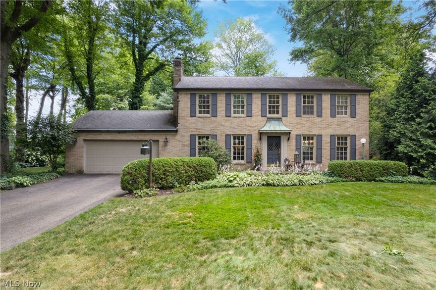 Beautiful brick Colonial on a gorgeous .46 acre wooded lot located so close to town, Washington Square, & Stark Parks Trail.  Exquisite details throughout and so much updating with custom gourmet Kitchen with cherry cabinetry, granite countertops, appliances, and 3rd oven in Kitchen island with breakfast bar & a wet bar.  Beautiful hardwood floors, fantastic Great Room addition with gas logs in fireplace & 2 sets of French doors to a brick patio on one side, and a deck off the other door.  Tranquil back yard with garden shed & grill area.  Bathrooms have been updated, Roof on Main Roof 2008, Roof for addition 2019, Gas Hot Water Tank, Furnace for 1st floor and basement 2018, Heat pump for 2nd floor 2018  & so much more!  City utilities.  Finished lower level Rec Room & Office too!