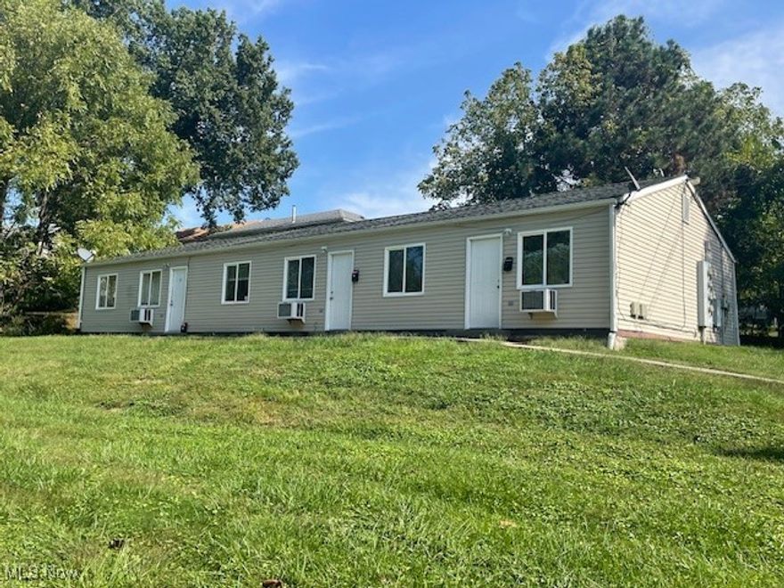 Tri=Plex for Sale.  All units are 2 Bedroom 1 Bath.  Baseboard heat.  Wall units for A/C and heat.  Grinder pump for sewer.  There is 3 additional lots included with this offering.  Could be more units.  Lower two lots are in the flood plain.  Owner pays for electric for pump $20 per month, Water $247 per month Trash $80 per month.