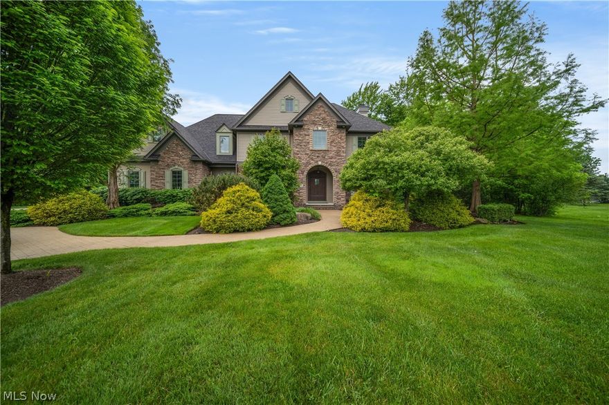 Welcome to this Payne and Payne built home in the beautiful Rocking Horse Farms Development. The home is truly built with no expense spared. From the moldings, ceilings, railings and design, this home is a true gem.  As you approach the home you will find the beautiful curb appeal. Once you enter you will find the foyer that leads to an office or dining room that can also be a sitting room. The great room has high ceilings, a wall of windows, built-in cabinets and fireplace. The kitchen has ample room to sit and enjoy a meal, a bar area, loads of cabinets, island, wall oven, cooktop and granite countertops. Right off the kitchen is a sunroom- perfect to sit and read or relax. There is a mud room for your convenience when you enter from the 3 car garage with storage lockers and a half bath that completes the first floor. Head upstairs and there are 4 bedrooms and the laundry room. The primary suite is spacious and the bath has a walk in shower, double vanities and a huge walk in closet. One bedroom has its own bathroom and the other three bedrooms share another hall bath. The laundry room is also conveniently located on the second floor. The finished basement has high ceilings and half bath, Outside there is a huge patio and another sitting area complete with firepit. Do not miss out on making this home yours all located in Kirtland Schools.