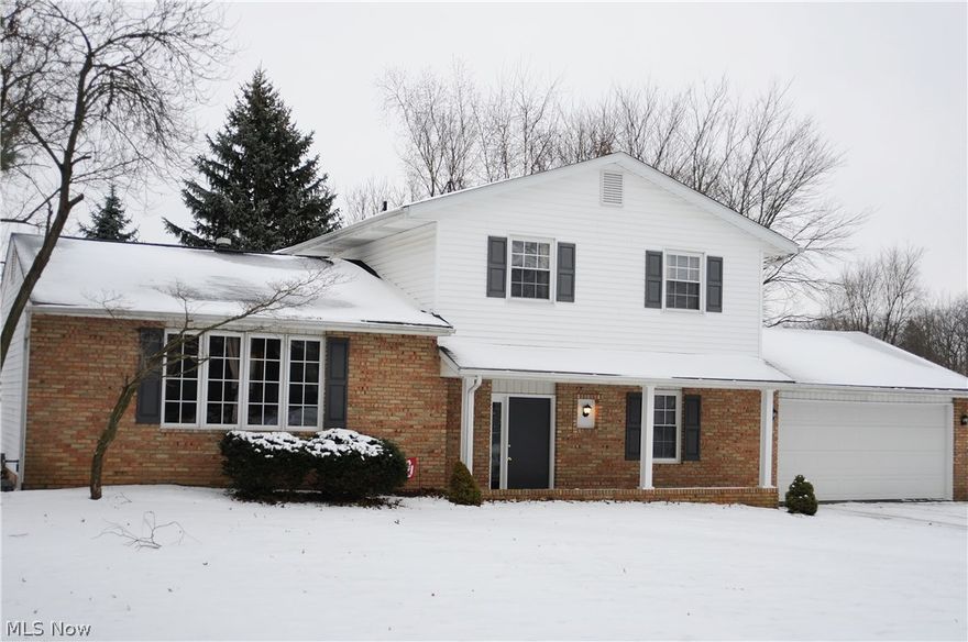 Beautiful 4 level split with many updates - furnace, C/A, Hot Water heater, Windows, Garage door, Newer Deck, - Nice open floor plan,  Family room with wood burning fireplace and wet bar. Updated kitchen fully applianced. Updated bathrooms