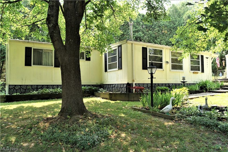 MOTIVATED SELLERS! Love, Laugh, and Live Lake style at Vo-Ash Lake! Sellers have loved this home, fulltime for 20 years and now it's time to 
downsize. This 1980 manufactured home has an enclosed porch and a screened in back porch! Step into the enclosed porch/family room filled with windows for lots of light and a wood burner for year-round use. Next step into the spacious living room with a beautiful hardwood floor. Next you'll enter the cozy kitchen and large dining area. Laundry area is behind the pantry doors. Back the hall you'll find the 2 bedrooms and 2 full bathrooms. Well maintained! Updated 200 amp electrical service approx. 3 years ago. 2 storage sheds and 7 parcels total. Sits next to a small park & pavilion owned by VoAsh. Very peaceful and private! Great Price! Don't miss out on this one!