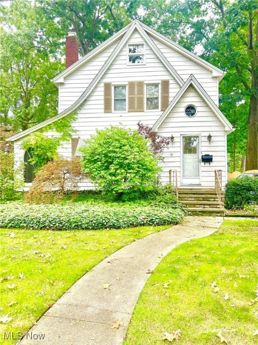 This charming three-bedroom, 1.5-bath Century home in the heart of Cuyahoga Falls boasts timeless character. Original hardwood floors flow throughout, highlighting the beauty of the home’s classic baseboards and trim. The cozy living room features a fireplace, perfect for relaxing evenings, and opens into a bright sunroom, ideal for morning coffee or a reading nook. With a newer roof and updated mechanics, this home blends historic charm with peace of mind. The property includes a one-car garage and offers the convenience of being close to local amenities, parks, and dining. This home is a true gem with plenty of character!