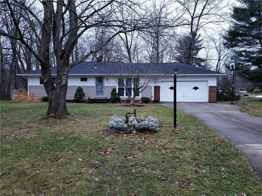 Three bedroom ranch home with a lovely deck overlooking a wooded ravine! There is a large living room, dining room with double doors to the deck, and a full size, partially finished basement.  Bring your design ideas to make this home your own!