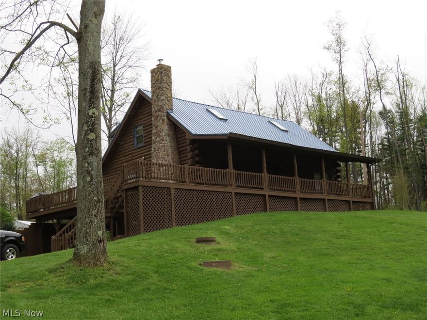 Private Setting Log Home on 11.39 Acres! Custom built 1989 1 1/2 story 3 or 4 bedroom, 2 1/2 baths situated on a dead end road. Home features stone fireplace, loft area, full walkout basement level, covered porches, and large deck. Home had a steel roof installed in 2015 and the exterior and interior was recently sealed. Property also includes a good 24x36 3 car detached garage with heated workshop above and a 2013 25x30 steel Quonset building with concrete floor for equipment storage. An outdoor wood furnace is plumbed into the home and the workshop for heating if so desired.The tracts are mainly wooded and there are fruit trees as well. If you like wildlife, nature, and privacy, this may be the one you're searching for! Call to view!