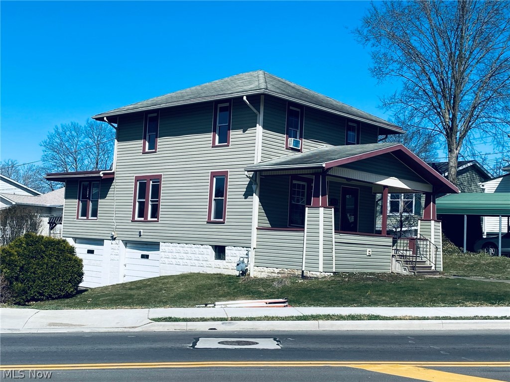 Lots of character w/newer windows, siding, & metal roof on backside addition. Home has a lot of potential but needs some finishing touches. Hardwood floors, many built-ins, 2 car basement garage. Home is selling in “As Is” condition. Homes includes 2 lots 65x45 each.