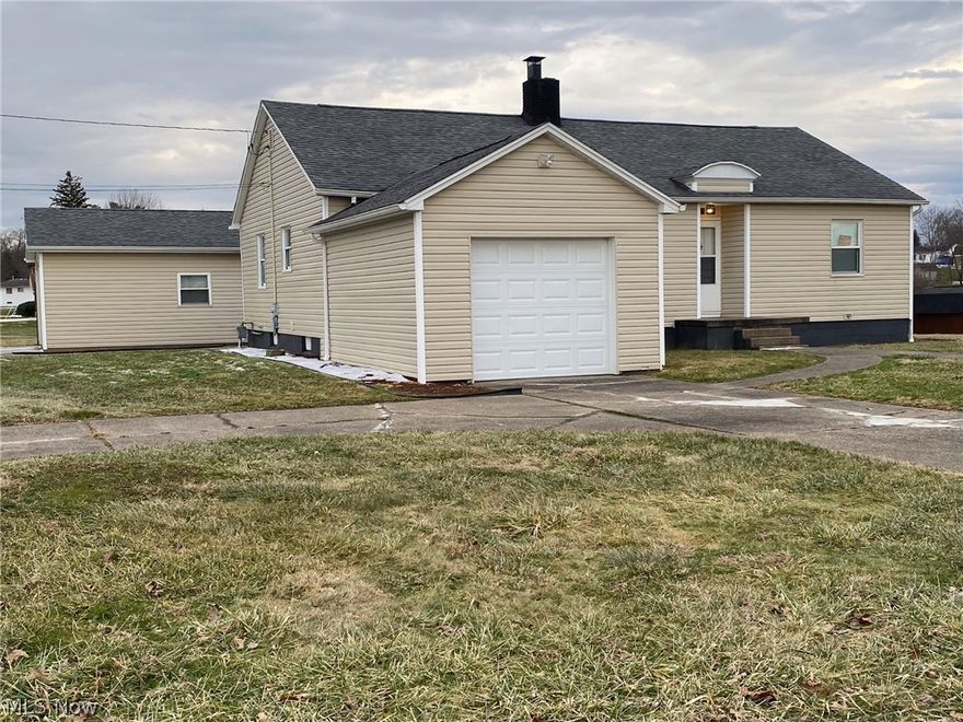 What hasn't been done on this one, New/Newer Roof, Siding, Windows, Gutter, Soffit, Fascia, Carpet, Light Fixtures, Wood Laminate Flooring in the Kitchen & Bath, Interior Painting & the White Wood Trim throughout.  This home offers  2 Bedrooms, 1 Bath, Large Living Room w/ a Fireplace, Formal Dining & an Eat in Kitchen. 1 Stall Attached & 2 Stall Detached Garage, a Storage Building & a 9X6 Covered Back Porch. A spotless unfinished basement w/ Laundry Hookup. There is a staircase to the attic which looks like it could be finished to a 3rd Bedroom or possibly the attached garage could be made into another Bedroom. So much to offer & room to make it even more to your needs all while sitting on almost an acre corner lot in the Lubeck & Blennerhassett School Districts. Call today for your Private Showing of this really nice home.   :)