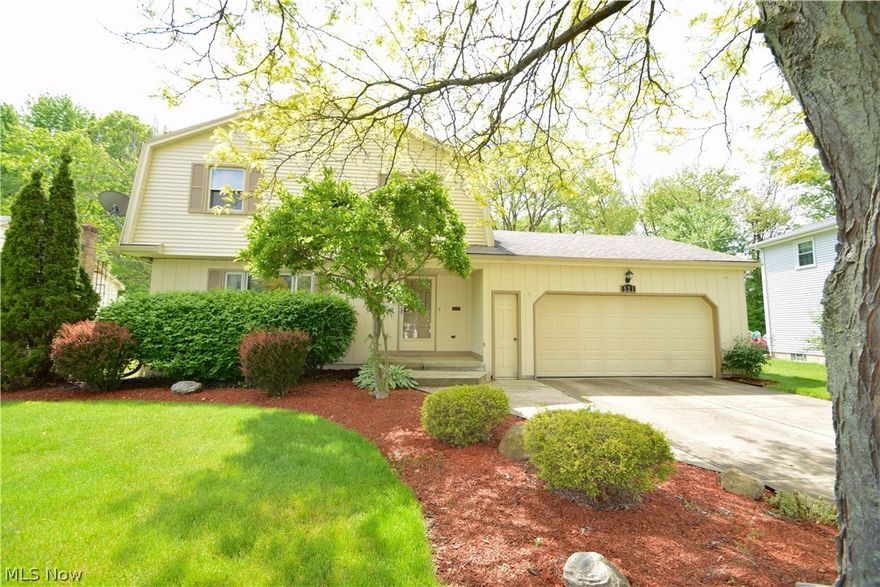 Spacious colonial in Applewood Acres. Open concept kitchen with center island overlooks the large family room with built in bookcases, fireplace and wet bar. The enclosed sun room off the family room has a private wooded view.  One year home warranty included.