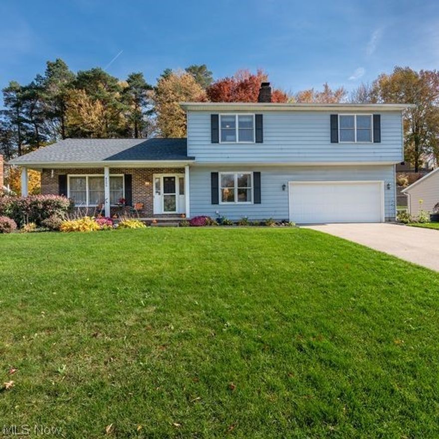 Fabulous SPACIOUS colonial in sought after Wyoga Lake Estates conveniently located just minutes to Rt. 8, restaurants & Cuyahoga Valley National Park!  Adorable front porch just waiting for a few rocking chairs & your favorite holiday decor!  Nice sized foyer leads to large living room complete with 
pergo wood flooring, a custom, cherry wood book case, perfect for the avid reader or collector of "things!"  Formal dining room has plenty of space to accomodate 6-8 comfortably.  Eat-in kitchen with white, bright cabinetry, a good sized pantry & sliding door that leads to the deck, brick patio and backyard.  Family room is HUGE with a nice gas fireplace, perfect for the upcoming winter months.  First floor 1/2 bath has been completed updated w/new tile floor, vanity and custom wood shelving you'll LOVE!  Upstairs you'll find a MASSIVE master suite w/walk in closet and a full updated bath w/tile shower, vinyl plank floor & new vanity.  Two other generously sized bedrooms and another updat