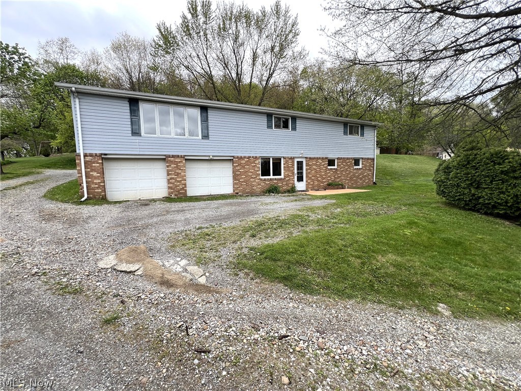 Three-bedroom, two-bathroom home with a finished walk-out basement and a two-car attached garage on nearly an acre. Beautiful view from the living room picture window! The main floor has three bedrooms, a full bathroom, an eat-in kitchen, a large living room, and two hall closets. The basement is finished with a full bathroom, laundry room, storage room/possible bedroom, rec room, and a family room. The family room has a man door leading to the front of the home. The family room also has cedar-sided walls and a wood ceiling with recessed lighting. The rec room was the original kitchen; all the plumbing has been capped in the wall and could be plumbed into. The storage room is large enough to be used as a bedroom. The attached two-car garage is accessed through the laundry room. The rear of the home has a large deck off the kitchen door. Perfect for outdoor chefs.