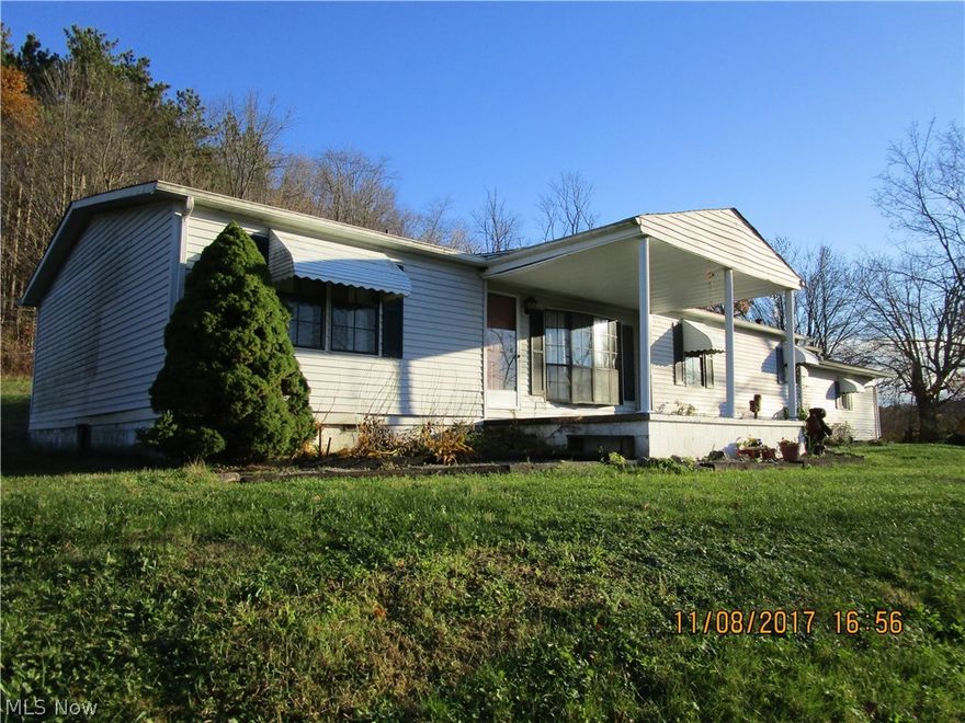 Spacious Doublewide on a block foundation. Huge living room with fireplace. Master bath has garden tub and separate shower. Laundry room off eat-in kitchen with laminate floor. Room addition needs flooring. Ideal family or rec room. Hot tub stays. Enclosed breezeway connects house and garage.