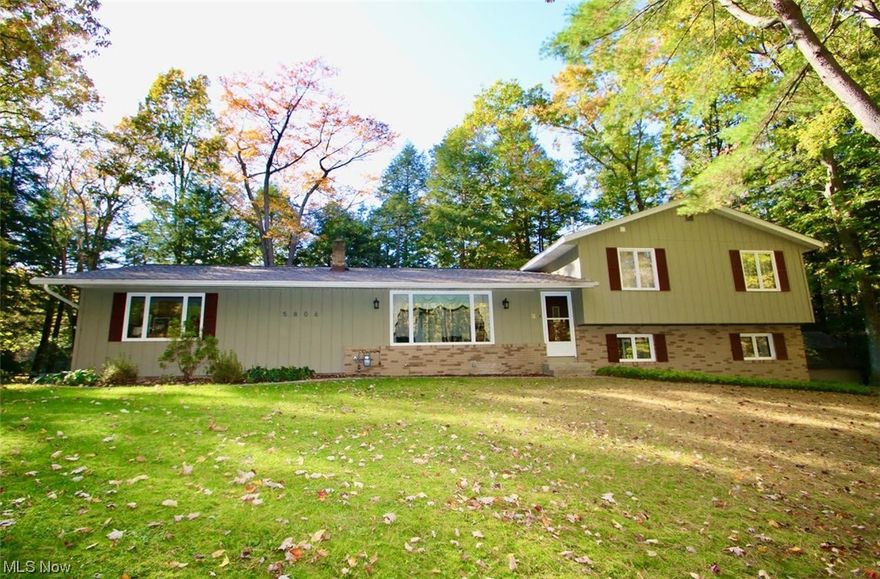 Prepared to be wowed by this charmer, situated on 2 parcels totaling over 3 private and picturesque acres in Leroy Township! 3 levels of living space plus a basement means this house lives larger than it looks. The front door opens to the formal living room with captivating views from the picture window. Also on this level is the updated kitchen and dining area. Through the kitchen you will find the teen/guest/in law suite with bedroom, full bathroom. kitchenette and second living area with its own entrance. The large master, second full bath and two additional bedrooms are on the upper level. Gleaming hardwood flooring runs throughout the main living area and bedroom level. On the lower level is the oversized family room with wood burning fireplace. Laundry and loads of storage are found in the basement ( which is accessible form both the in law suite and the main living area). Sliders from the dining area open to the large deck overlooking the ravine below. A screen house adds another cozy place to relax and enjoy the magnificent views.  The extra wide paved drive and four car garage means plenty of room for vehicles and toys. Pride of ownership shines throughout this home ( Please see home facts in supplements for extensive list of updates and maintenance). Schedule your showing today!