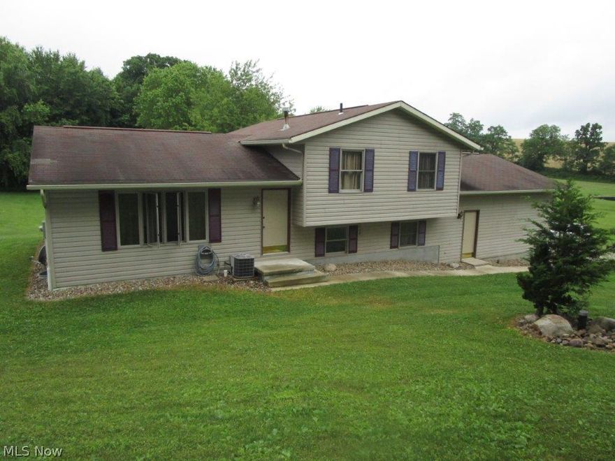 Well maintained 3 bedroom home consists of 3 full baths, kitchen, living room/study, large laundry room and attached 2 car garage with loft storage area and has updated floor coverings including plenty of tile and hardwood floors. The mechanics of the home are gas heat, central air, water softner and private well/septic.  The location is ideal with West Holmes High School visible across SR 39 and sits on a 5 acre lot with a large yard and several acres of woods. Minerals owned by the seller will transfer with the property.