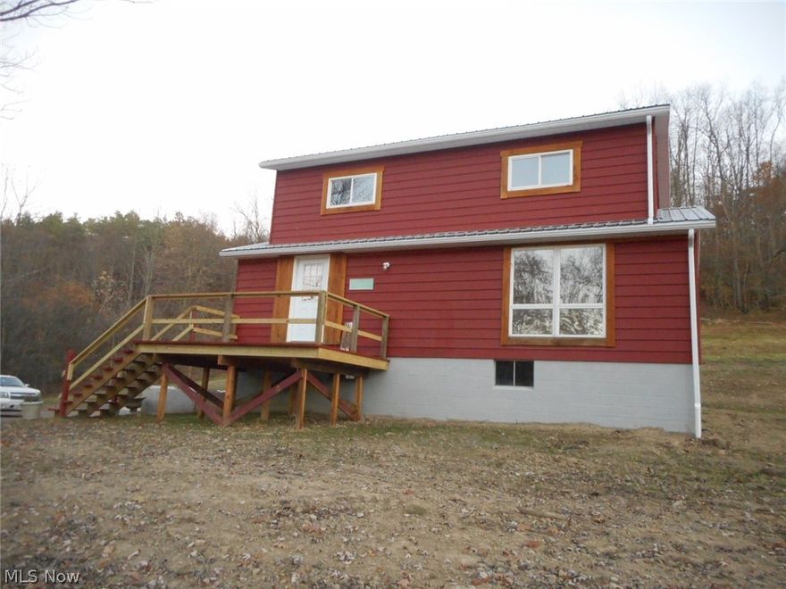 Privacy in a serene country setting awaits you in this 3 bedroom/2 full bath newly remodeled home.  New front deck welcomes you into the huge living room w/beautiful wood floors & rustic wood trim which is thru-out the house.  New fully equipped stainless kitchen, spacious sun porch w/access to large rear lot, main floor laundry, 2 new bathrooms plus oversize double car garage featuring a full 2nd level of storage.  Beautiful panoramic views.  1 year Home Warranty.