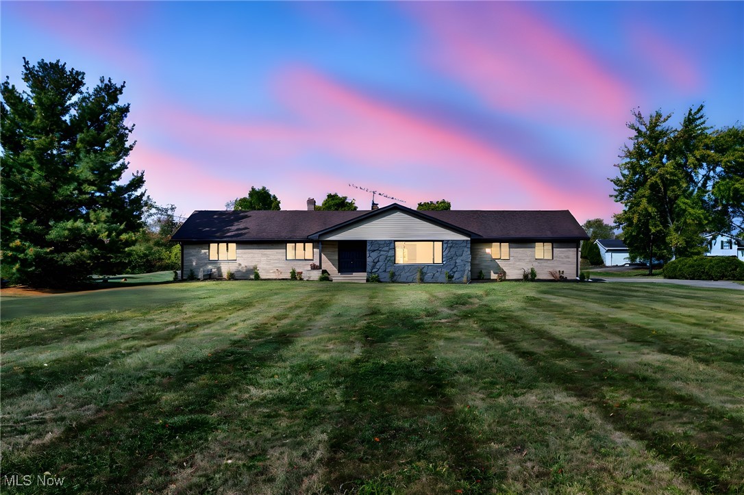 (Full video available!) Elegant & sophisticated, premium all-brick 4-bedroom, 4-bath ranch home offers the perfect combination of style, space, & functionality. Situated on nearly 2 acres w/large outbuilding/barn featuring a concrete floor for endless possibilities, this home is a one of a kind find. Oversized side-load garage includes epoxy floors, additional storage, & direct basement access. Large drive for ample parking. Amazing fully finished basement is a showstopper—designed for entertaining with a ballroom-like rec room, quartz-topped kitchen & bar area, 3 additional finished rooms, & 2 storage rooms. Step inside through the grand double front doors to a dramatic, light-filled interior w/new modern LED lighting, walls of windows, & direct wooded backyard views. One-of-a-kind new gourmet kitchen features dramatic hardware, custom tile backsplash, oversized chef’s island w/breakfast bar, walls of cabinetry, quartz counters, 5-burner gas range, & stainless appliances (included). Spectacular family room boasts an 8 ft. slider flanked by glass panel windows, leading to a perfect deck for outdoor entertaining. Private owner’s suite is designed to impress, featuring a spa-like custom walk-in shower, beautiful vanities, & spacious walk-in closet. All hard surface flooring and quartz counters throughout highlight the enduring quality and thoughtful updates. Home tied into sewer. Immediate occupancy available—easy to show. Don’t miss this extraordinary property that blends sophistication, comfort, and country-style living with modern luxury!